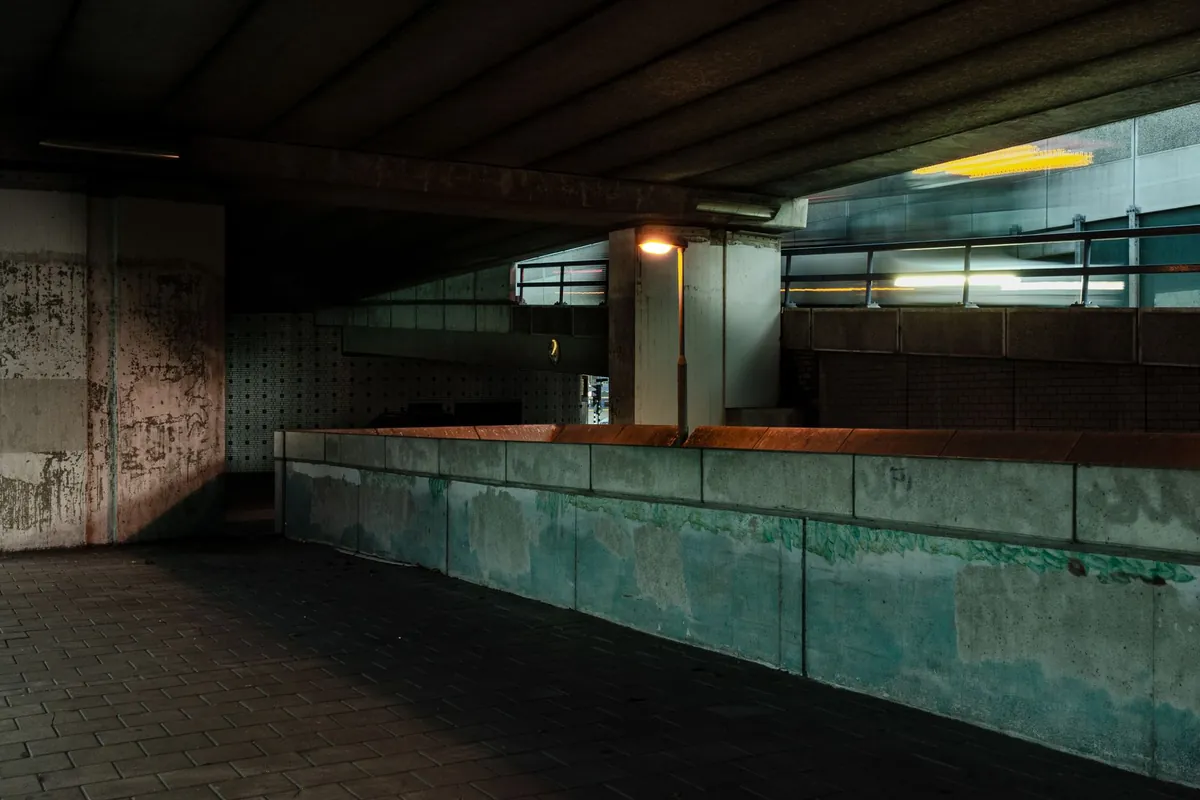 Dim concrete underpass in an urban area with no people
