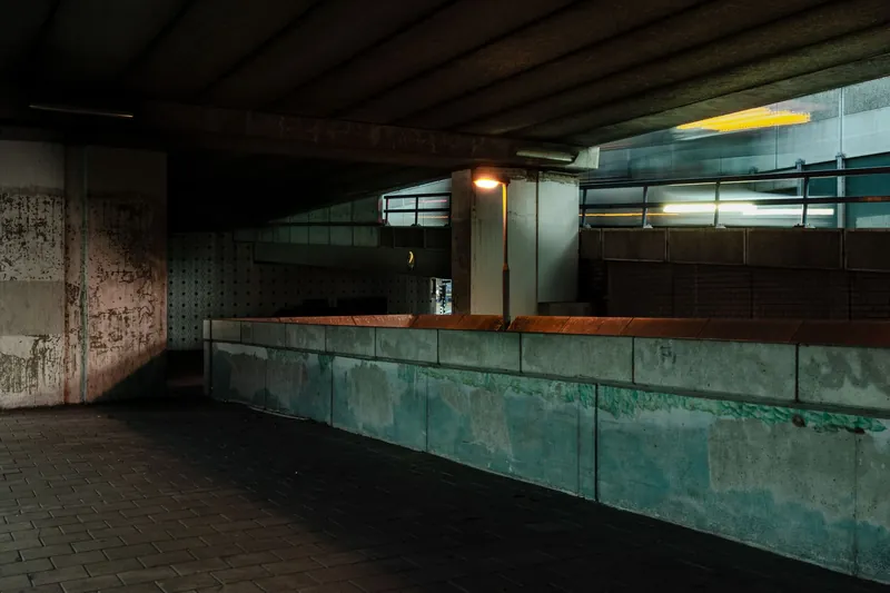 Dim concrete underpass in an urban area with no people